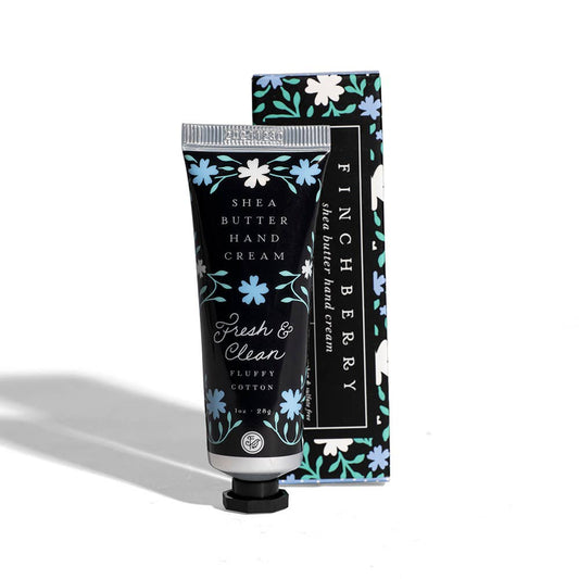 Hand cream tube and box in black with blue and white floral print, featuring the Fresh & Clean Hydrating scent label.