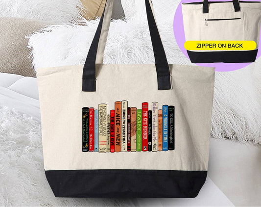 Canvas zipper tote in natural cotton with black handles and base, featuring a colorful row of book spines; Banned Books - Reading Library Novels design.