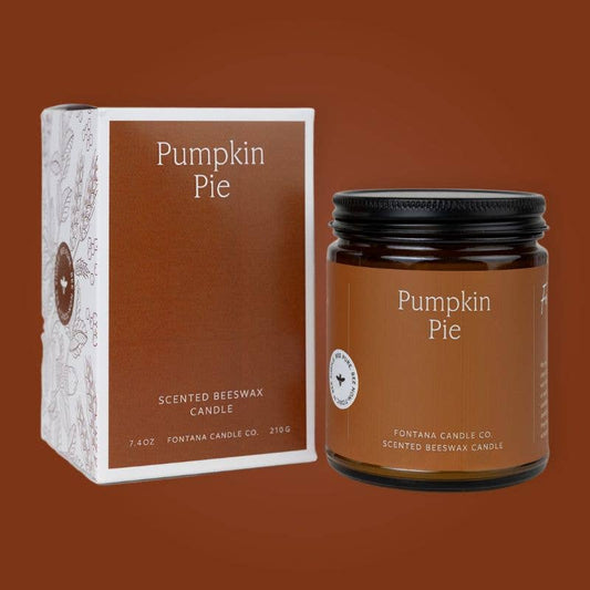Beeswax jar candle in a brown glass jar with black lid and wooden wick, beside a matching Pumpkin Pie box.