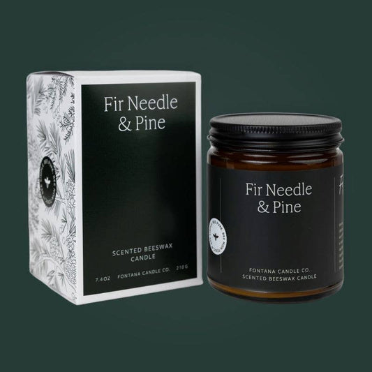Beeswax jar candle with Fir & Pine Essential Oil, amber glass, black lid and dark evergreen label in a printed box.