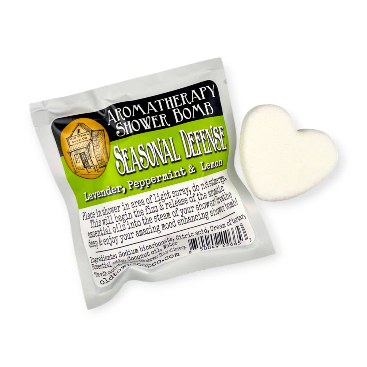 Shower Bombs/Steamer Singles in a white heart shape beside a sealed pouch labeled Seasonal Defense, with a green label.
