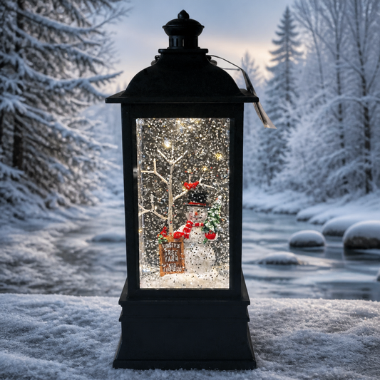 Musical lighted lantern, black plastic with swirling glitter, snowy tree and Frosty's Tree Farm sign inside.