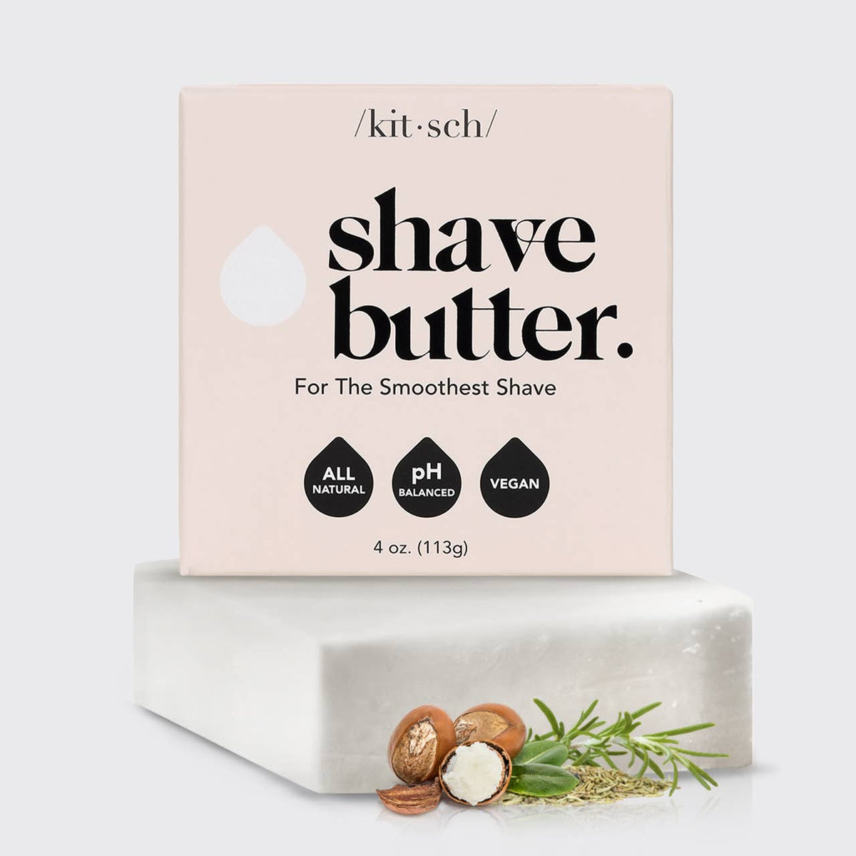 Solid Shave Butter in a pale pink carton beside a white rectangular bar, with botanical sprigs and nuts as accents.