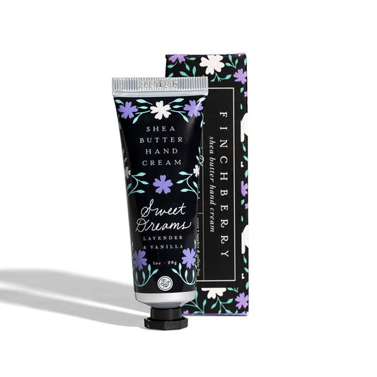 Sweet Dreams Hydrating hand cream in a black tube with colorful floral patterns, lavender and vanilla labeling, and matching box