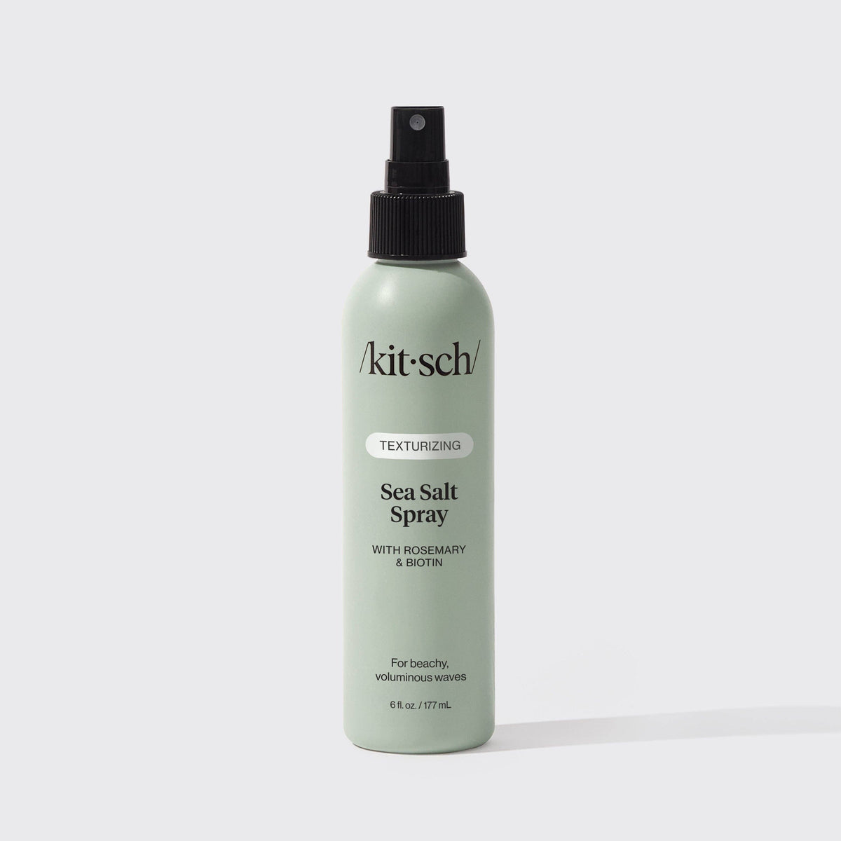 Texturizing Sea Salt Spray in a pale sage green bottle with a black spray nozzle and minimalist black lettering.