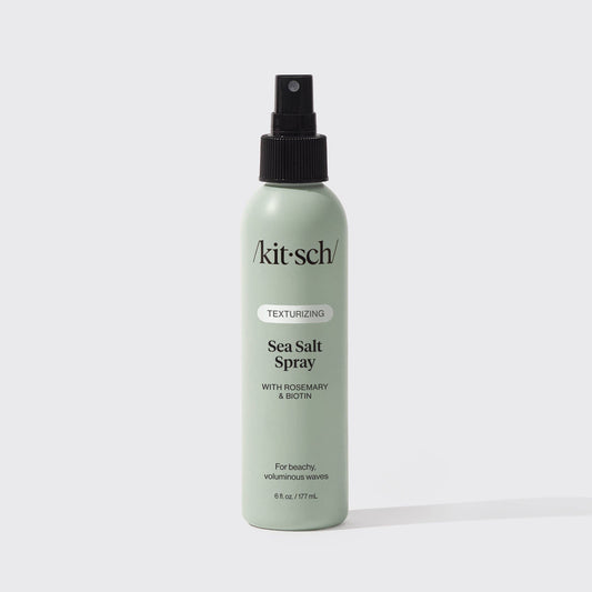 Texturizing Sea Salt Spray in a pale sage green bottle with a black spray nozzle and minimalist black lettering.