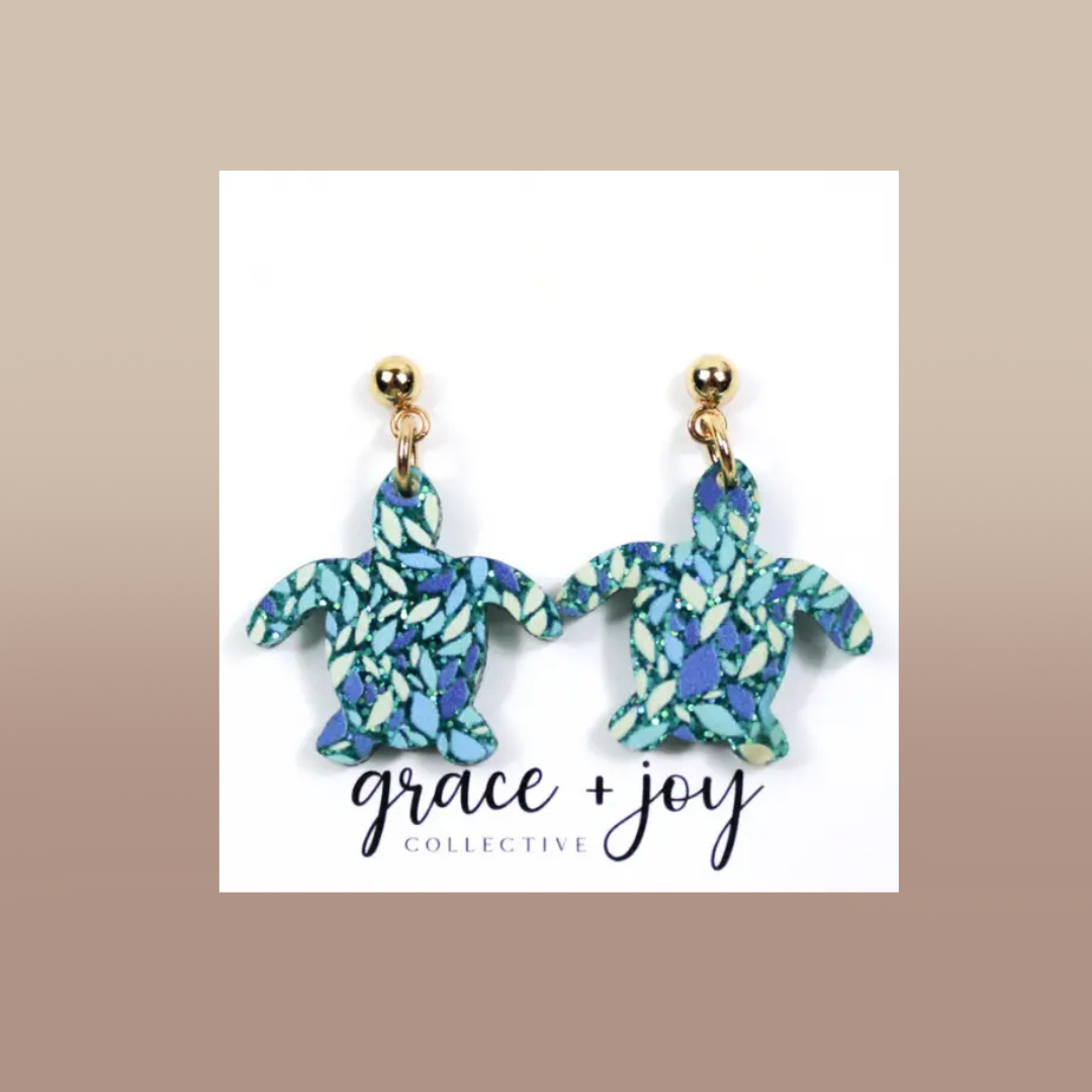Glitter Turtle Dangle Earrings in turquoise, blue, and green patterned acrylic, with gold-tone stud posts and turtle-shaped charms.